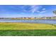 Picturesque view of a serene lake, showcasing the beautiful surroundings of the property at 16273 Coconut Palm Dr, Port Charlotte, FL 33953