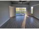 Well-lit main bedroom with hard surface floors and glass sliding doors at 172 Coblentz St, Port Charlotte, FL 33954