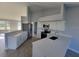 Bright kitchen featuring white cabinets, stainless steel appliances, and quartz countertops at 172 Coblentz St, Port Charlotte, FL 33954