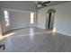 Spacious living room featuring hard surface floors, recessed lighting, and bay windows at 172 Coblentz St, Port Charlotte, FL 33954
