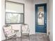 Charming front porch with seating and a decorative front door, perfect for relaxing and enjoying the neighborhood at 19241 Serafina St, Venice, FL 34293