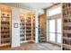 Well-stocked community library with rows of bookshelves and comfortable reading space near windows at 19241 Serafina St, Venice, FL 34293