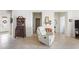 Open-concept living area with neutral decor, leading to a bedroom and entryway at 19241 Serafina St, Venice, FL 34293