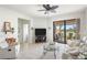 Comfortable living room with sliding glass doors leading to the outdoor patio at 19241 Serafina St, Venice, FL 34293