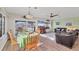 Open dining area with natural light, seamlessly connected to the living room and a view of the outdoor pool at 1960 Mississippi Ave, Englewood, FL 34224
