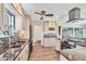 Bright kitchen featuring stainless steel appliances, granite counters, and updated cabinetry with seamless access to dining area at 1960 Mississippi Ave, Englewood, FL 34224
