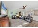 Spacious living room featuring neutral walls, laminate wood floors, and comfortable seating at 1960 Mississippi Ave, Englewood, FL 34224