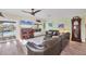 Comfortable living room with view of pool and outdoor area with tile flooring and neutral tones at 1960 Mississippi Ave, Englewood, FL 34224