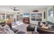 Cozy living room with a large window offering views of the pool and outdoor area at 1960 Mississippi Ave, Englewood, FL 34224