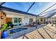 Inviting patio with a hot tub and comfortable outdoor seating, ideal for relaxation at 1960 Mississippi Ave, Englewood, FL 34224