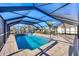 Spacious covered pool area with comfortable seating, perfect for entertaining guests at 1960 Mississippi Ave, Englewood, FL 34224