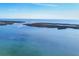 A beautiful waterfront view of the ocean and coastline on a bright sunny day at 1960 Mississippi Ave, Englewood, FL 34224