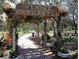 Scenic entrance to Venice Arboretum with lush flowers and walking paths, a tranquil escape at 20110 Ragazza Cir # 102, Venice, FL 34293