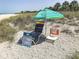 Beach chair and umbrella rentals displayed, perfect for relaxing by the ocean and soaking up the sun at 20110 Ragazza # 102, Venice, FL 34293