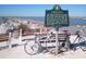 A scenic coastal view featuring Casey's Pass historic marker, benches, and bicycles, combining history with recreation at 20110 Ragazza # 102, Venice, FL 34293