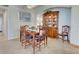 Traditional dining room with wood table set, display cabinet and elegant chandelier at 20110 Ragazza Cir # 102, Venice, FL 34293