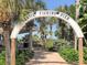 Entrance to Venice Fishing Pier with lush palms, vegetation, and a pathway to the pier at 20110 Ragazza Cir # 102, Venice, FL 34293