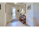 Warm and inviting foyer with tile flooring, decorative mirror, and stylish console table at 20110 Ragazza Cir # 102, Venice, FL 34293