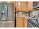 Featuring stainless steel appliances, wood cabinetry, and granite countertops, this kitchen is designed for efficiency and style at 20110 Ragazza Cir # 102, Venice, FL 34293