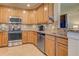 This kitchen showcases stainless steel appliances, granite countertops, and wood cabinetry with ample storage space at 20110 Ragazza Cir # 102, Venice, FL 34293