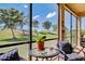 Cozy screened lanai with comfortable seating, perfect for enjoying the beautiful view at 20110 Ragazza Cir # 102, Venice, FL 34293
