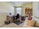 This well-lit office includes a wooden desk, comfortable seating, storage, and decor, creating a functional workspace at 20110 Ragazza Cir # 102, Venice, FL 34293