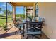 Inviting screened patio with dining set, offering views of lush landscaping at 20110 Ragazza Cir # 102, Venice, FL 34293