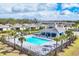Aerial view of the beautiful community pool and surrounding homes in the neighborhood at 2088 Bonito Way, Port Charlotte, FL 33953