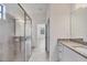 Bathroom with a granite countertop and a glass enclosed shower at 2088 Bonito Way, Port Charlotte, FL 33953