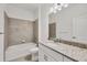 Well-lit bathroom featuring granite countertops, a bathtub, and a modern design at 2088 Bonito Way, Port Charlotte, FL 33953
