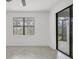Bedroom featuring natural light from the windows and a sliding glass door at 2088 Bonito Way, Port Charlotte, FL 33953