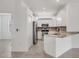 Well-equipped kitchen features granite countertops, stainless steel appliances and white cabinets at 2088 Bonito Way, Port Charlotte, FL 33953