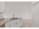 Bright kitchen featuring granite countertops, stainless steel sink, and nearby open floor plan at 2088 Bonito Way, Port Charlotte, FL 33953