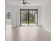 Bright living room with tiled floors and large sliding doors leading to outdoor patio at 2088 Bonito Way, Port Charlotte, FL 33953
