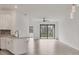 Living room with ceiling fan, sliding glass doors, tile floor, and bright, open space at 2088 Bonito Way, Port Charlotte, FL 33953