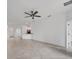 Open-concept living room with tiled floors, ceiling fan and neutral color palette at 2088 Bonito Way, Port Charlotte, FL 33953
