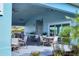 A covered outdoor patio offers comfortable seating and shade at 2088 Bonito Way, Port Charlotte, FL 33953