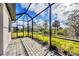Large screened in lanai, with beautiful greenery and outdoor view at 2088 Bonito Way, Port Charlotte, FL 33953