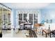Cozy living room with large windows, comfortable seating, and plenty of natural light at 22032 Felton Ave, Port Charlotte, FL 33952