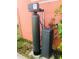 Installed Culligan water softener system and holding tank shown on the exterior of the home at 22032 Felton Ave, Port Charlotte, FL 33952