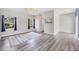 Comfortable living room with hardwood floors, ceiling fan, and lots of natural light at 224 Pine Glen Ct, Englewood, FL 34223