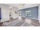 Spacious living room with wood flooring, large windows, ceiling fan and backyard views at 224 Pine Glen Ct, Englewood, FL 34223