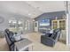Comfortable living area with vaulted ceilings, neutral decor, and an open layout at 224 Pine Glen Ct, Englewood, FL 34223