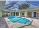 Screened-in pool featuring a spacious deck, connecting multiple areas of the home at 224 Pine Glen Ct, Englewood, FL 34223