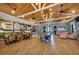 Open common area featuring wood floors, tables with chairs, lounge seating, and coffee bar at 23781 Waverly Cir, Venice, FL 34293