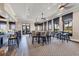 A stylish dining area with comfortable seating, scenic outdoor views, and a well-stocked bar at 23781 Waverly Cir, Venice, FL 34293