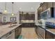 Well-appointed kitchen featuring granite countertops, stainless steel appliances, and abundant cabinet storage at 23781 Waverly Cir, Venice, FL 34293