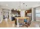 Stylish kitchen boasts a large island with seating, stainless steel appliances, and ample cabinet space at 23781 Waverly Cir, Venice, FL 34293