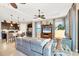 Open-concept living area featuring a modern kitchen, comfortable seating, and stylish decor at 23781 Waverly Cir, Venice, FL 34293