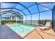 Picturesque screened in pool with view of the lake at 23781 Waverly Cir, Venice, FL 34293